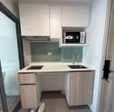 May be an image of cooker hood, kitchen island and indoors